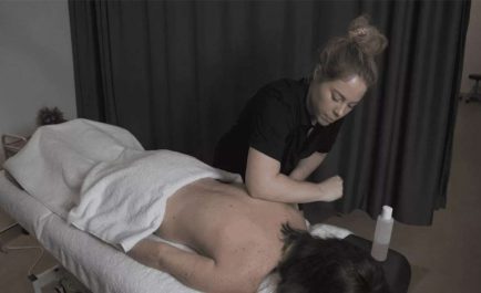 massage-class Qacademy student undertaking remedial massage assessment