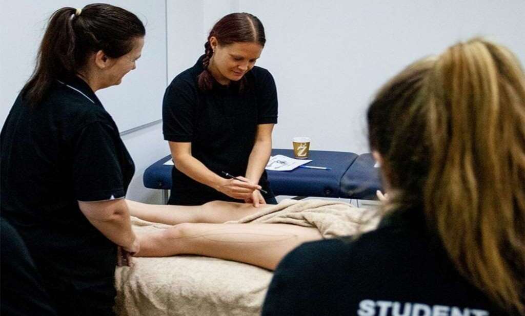 Students conducting remedial massage training